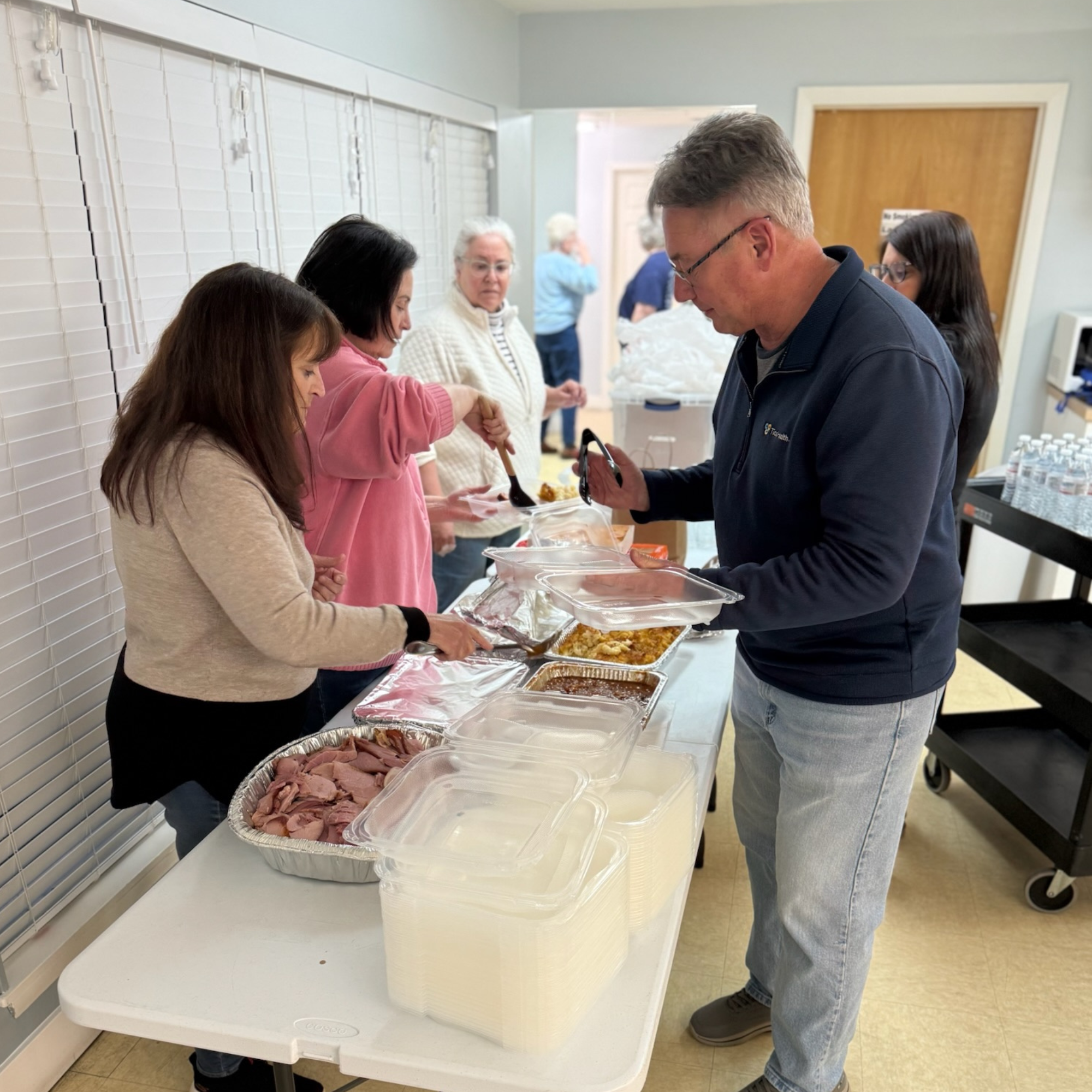 volunteers preparing and distributing meals
