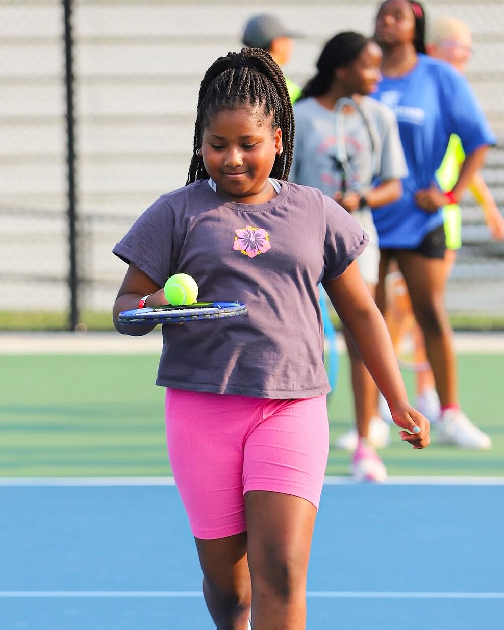 a student practicing tennis drills