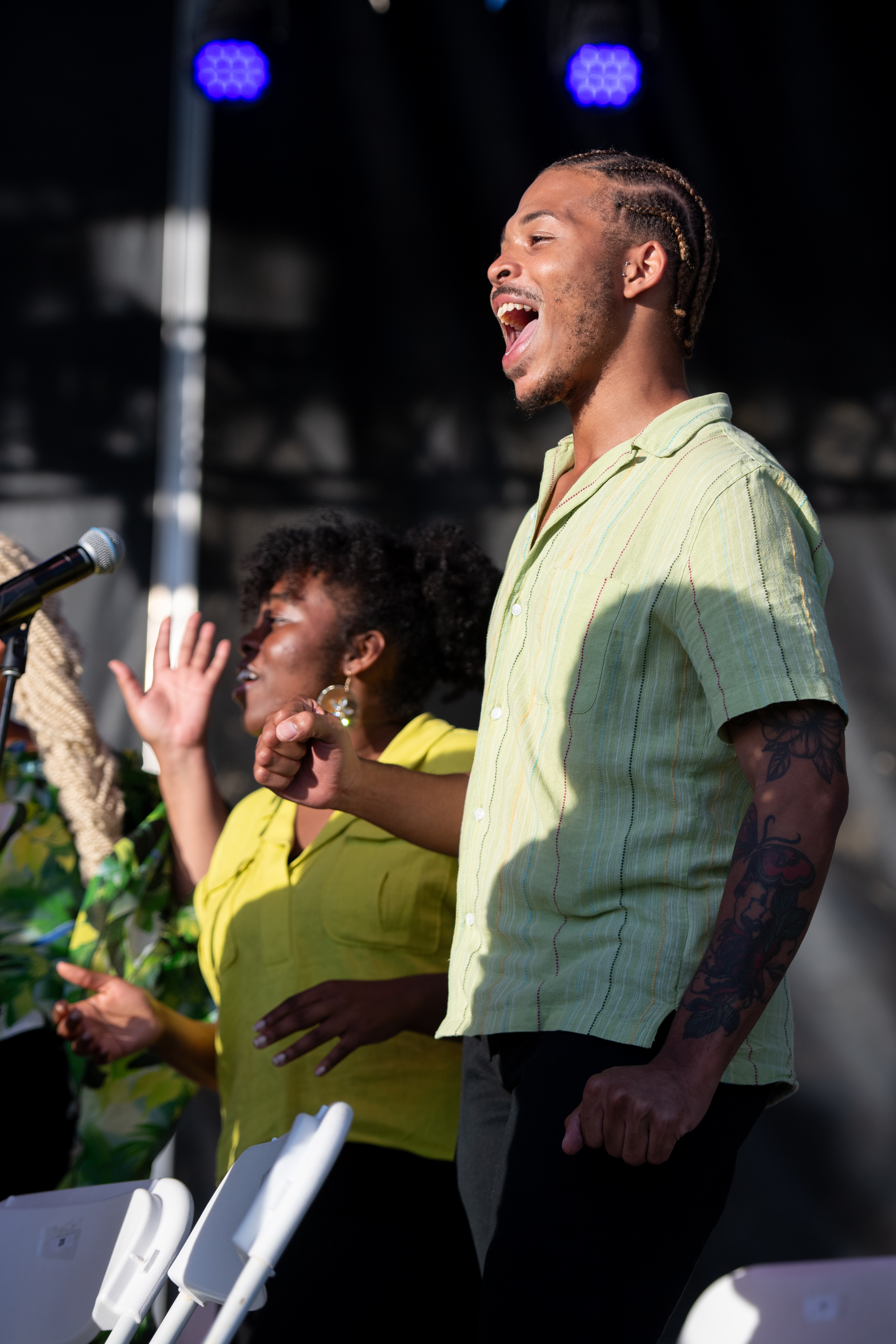 a music performer singing on stage.
