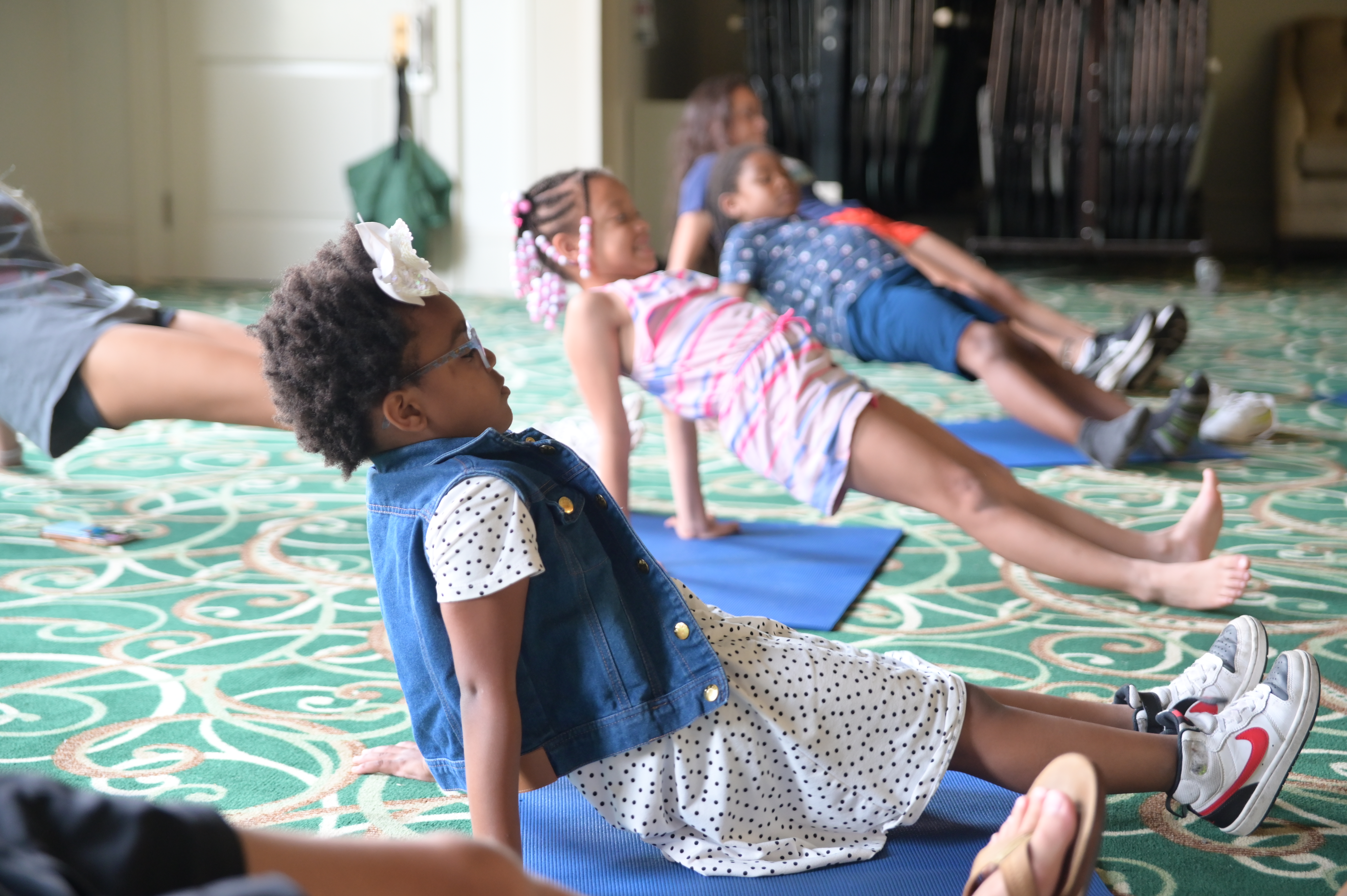 children stretching with a teacher.