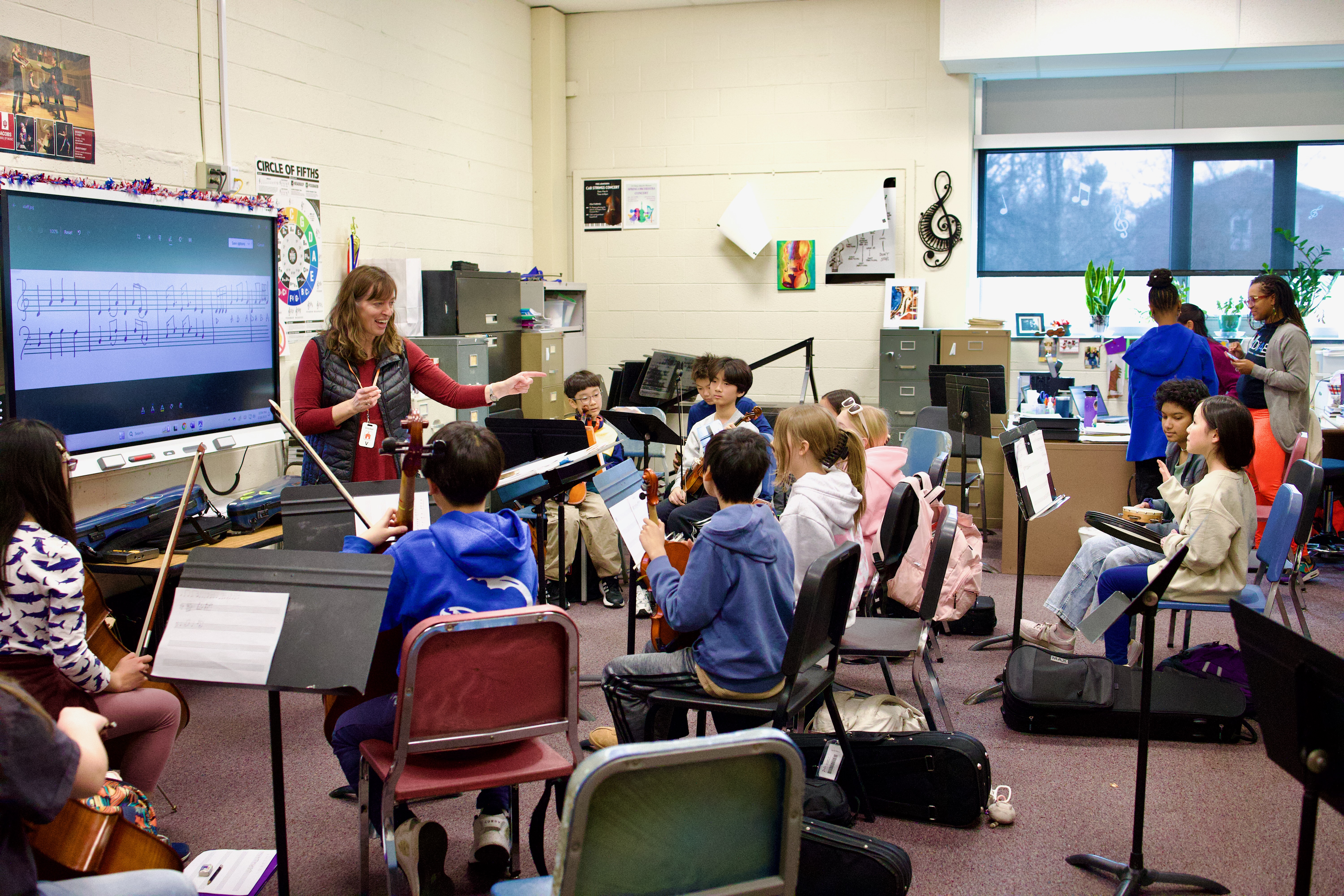 kids learning music in a school room