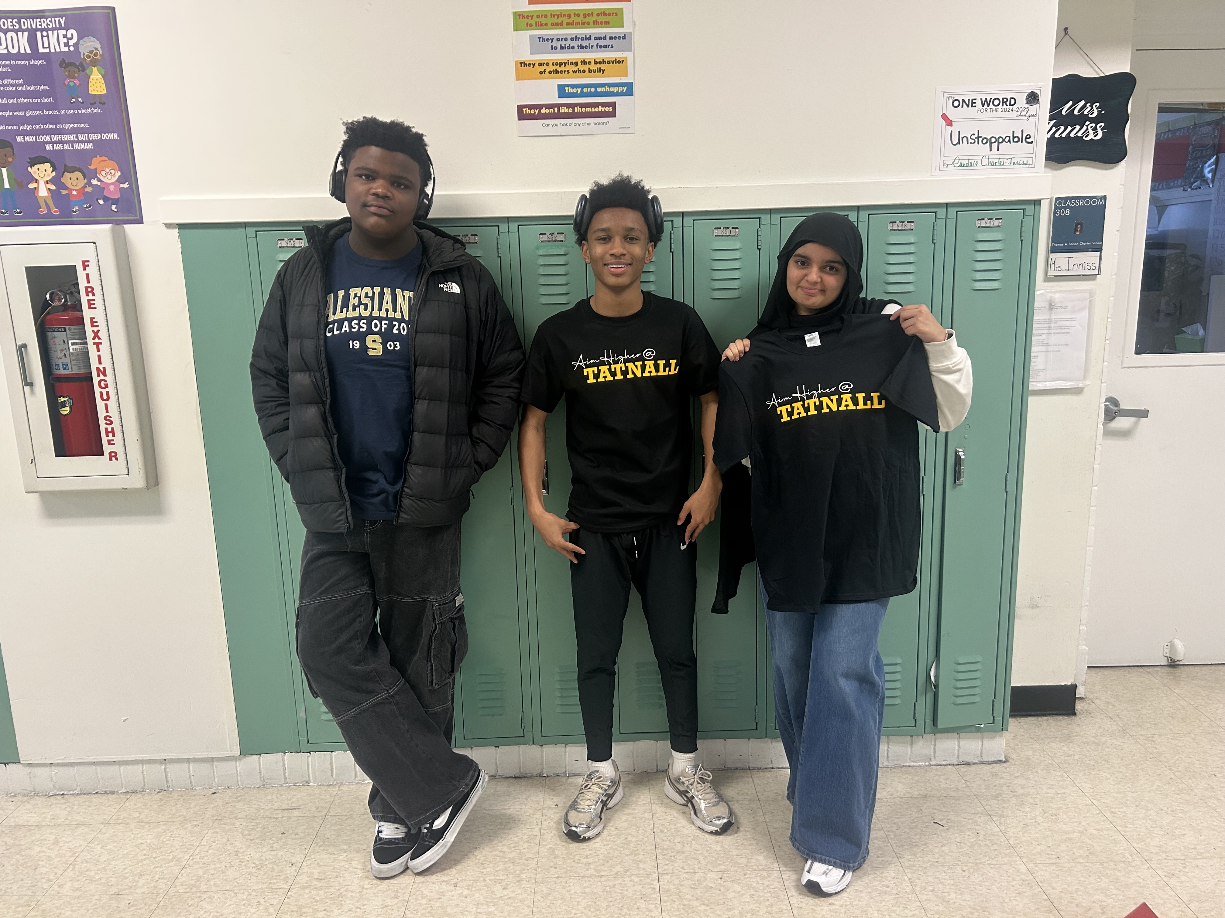 students posing in their t-shirts for school acceptance.