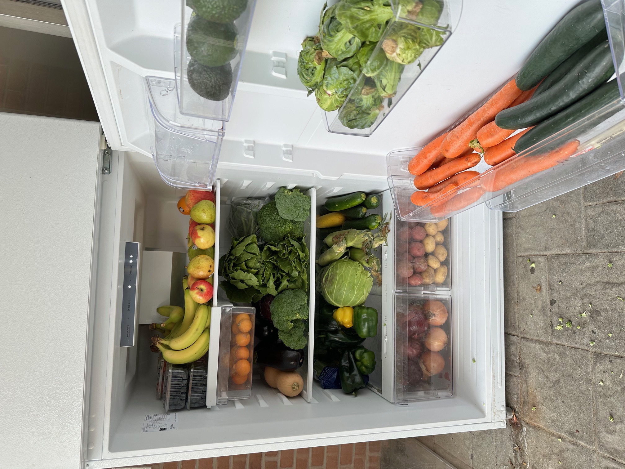food and produce stocked in a community fridge.