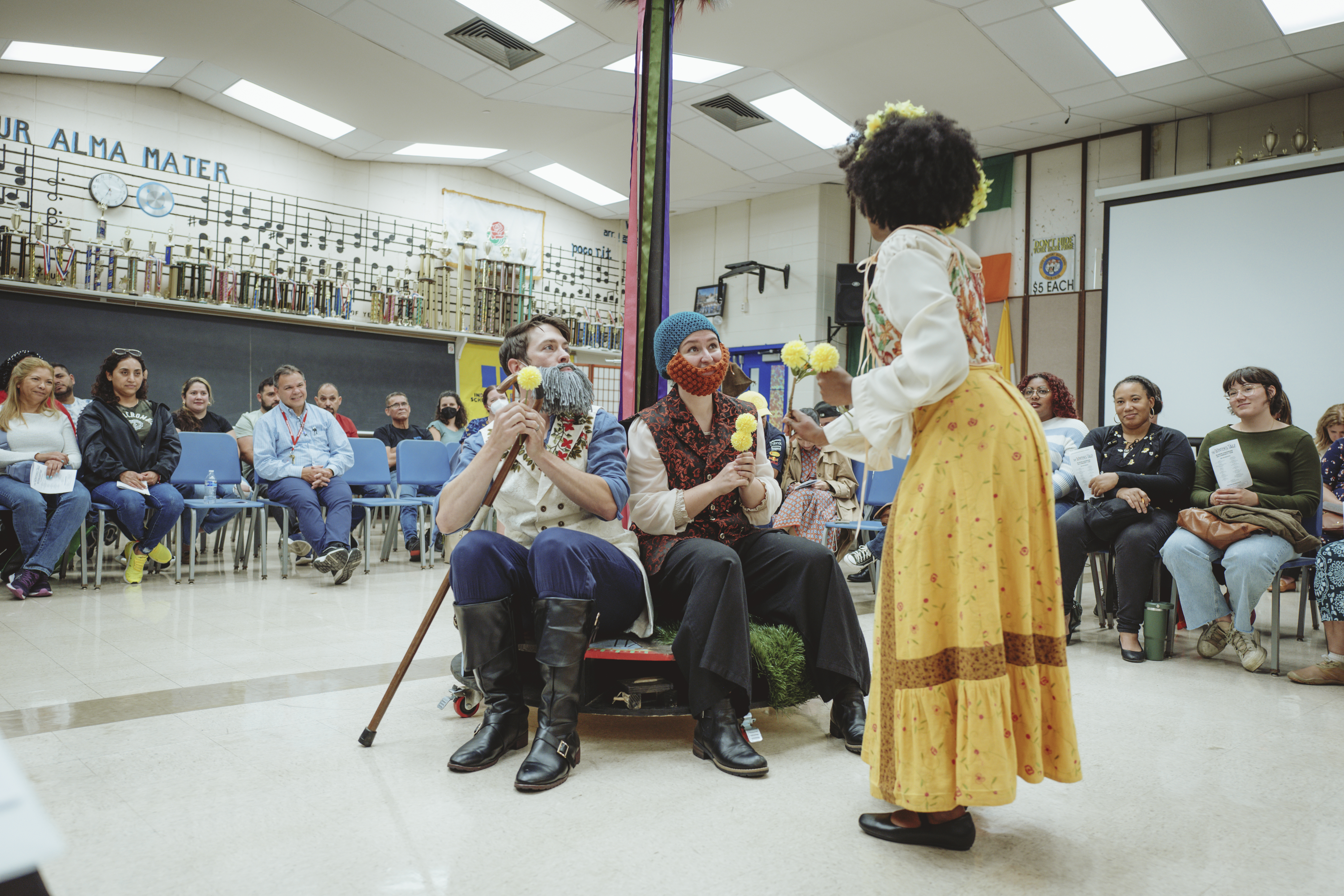 participants performing in a play for a community center.