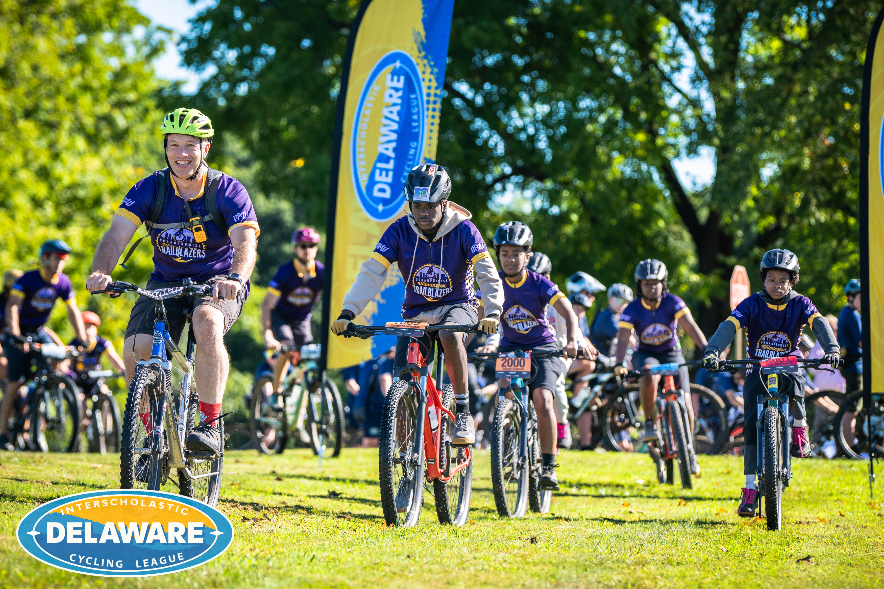 a group of youth biking in a competition.