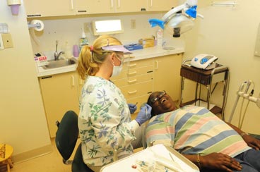 two people in a dental exam room.