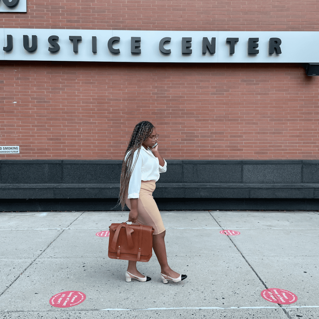 a woman walking into a building called the Justice Center in Wilmington