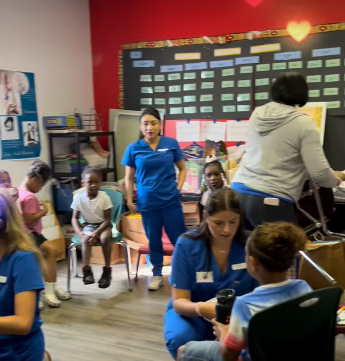 University of Delaware assists with a reading initiative in the center's reading library room.