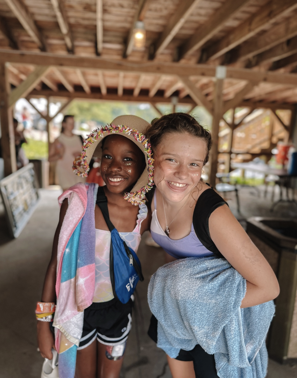 a student and camp counselor posing