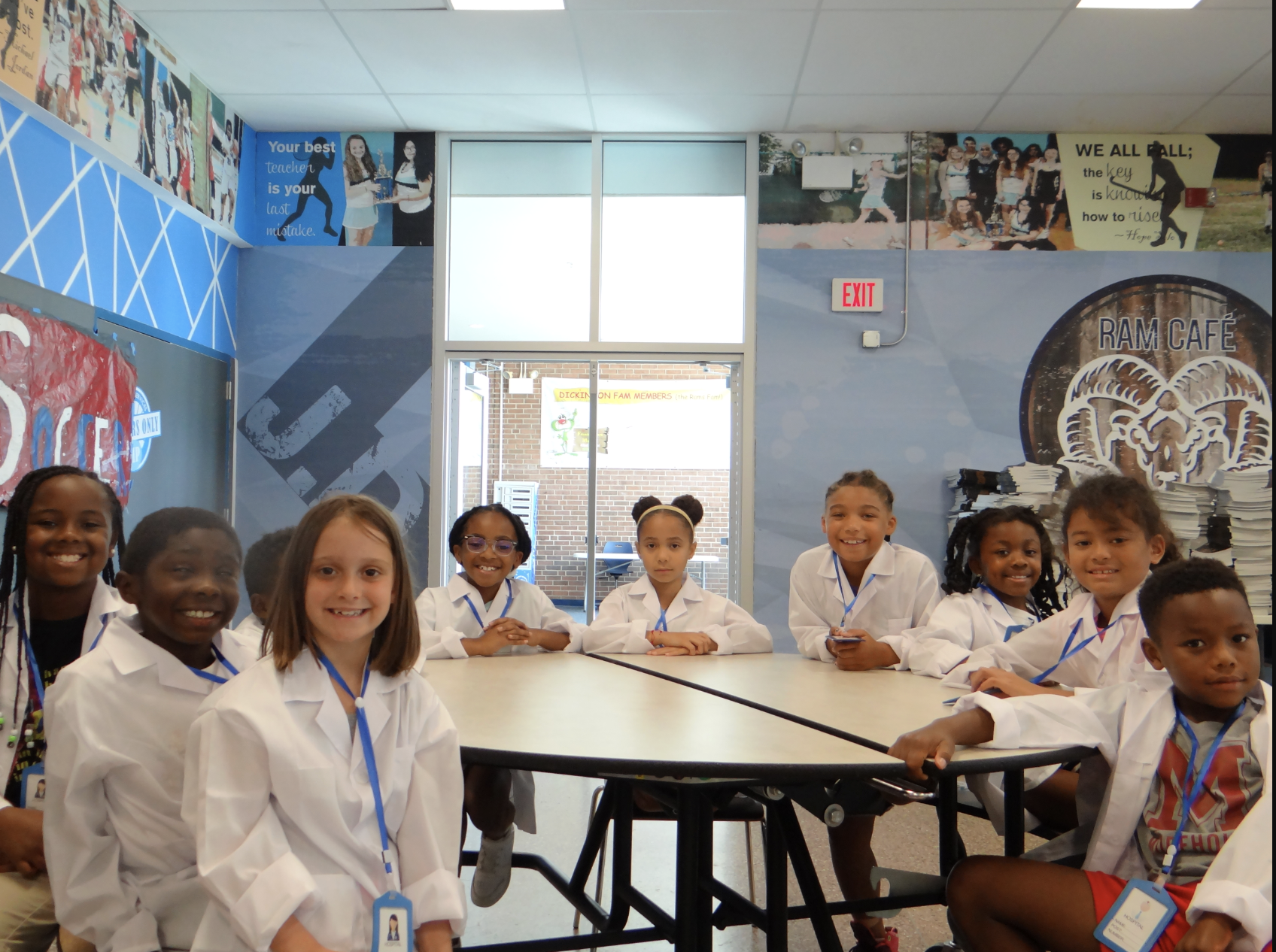 students sitting with lab coats