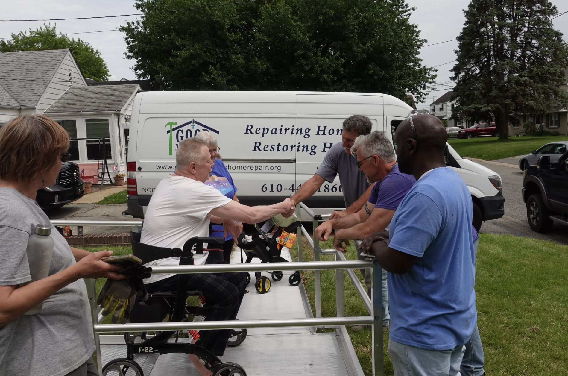 volunteers working on a house