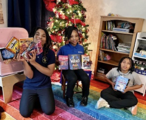 children posing for a photo with holiday items