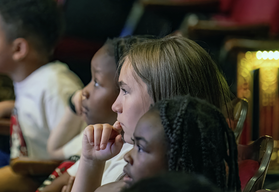 students watching a performance