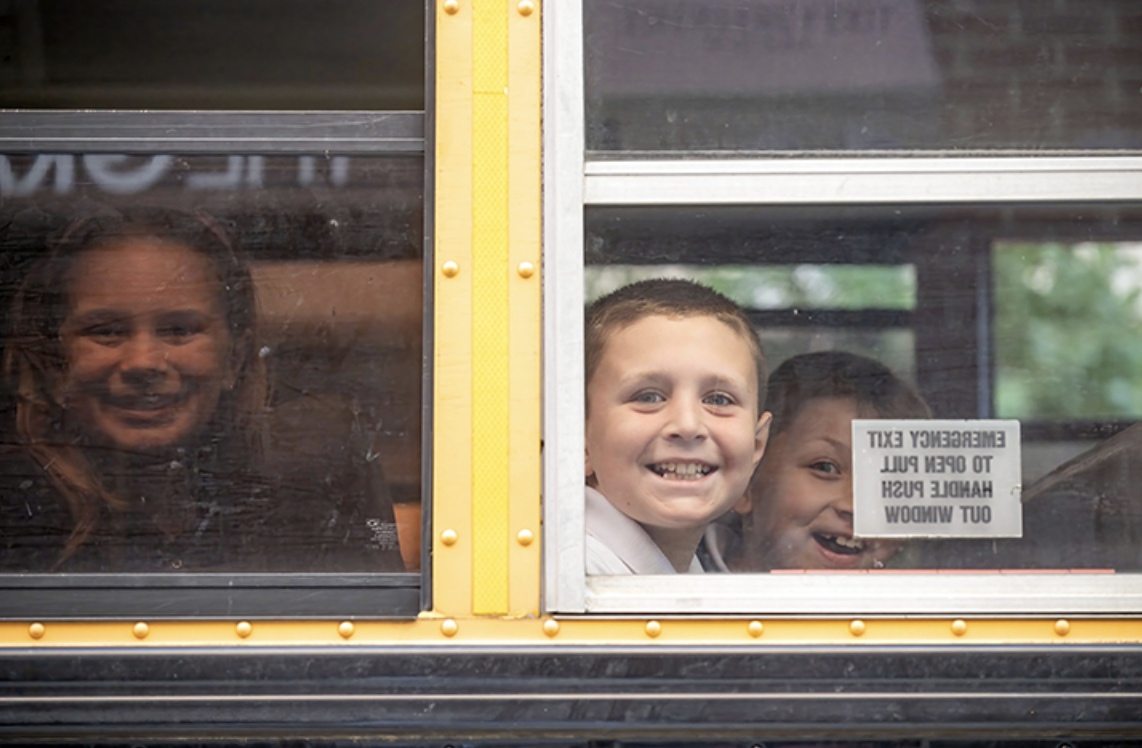 students riding a bus