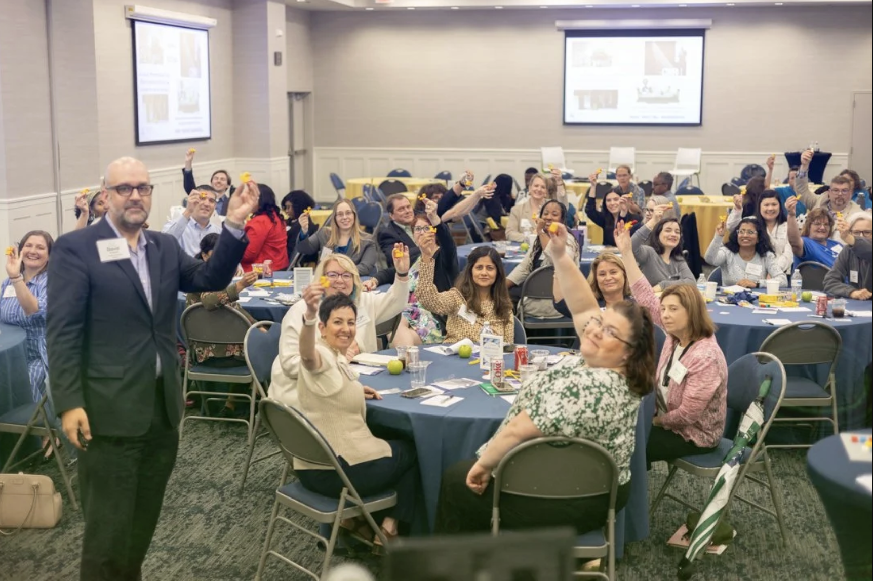 a group sitting at a conference