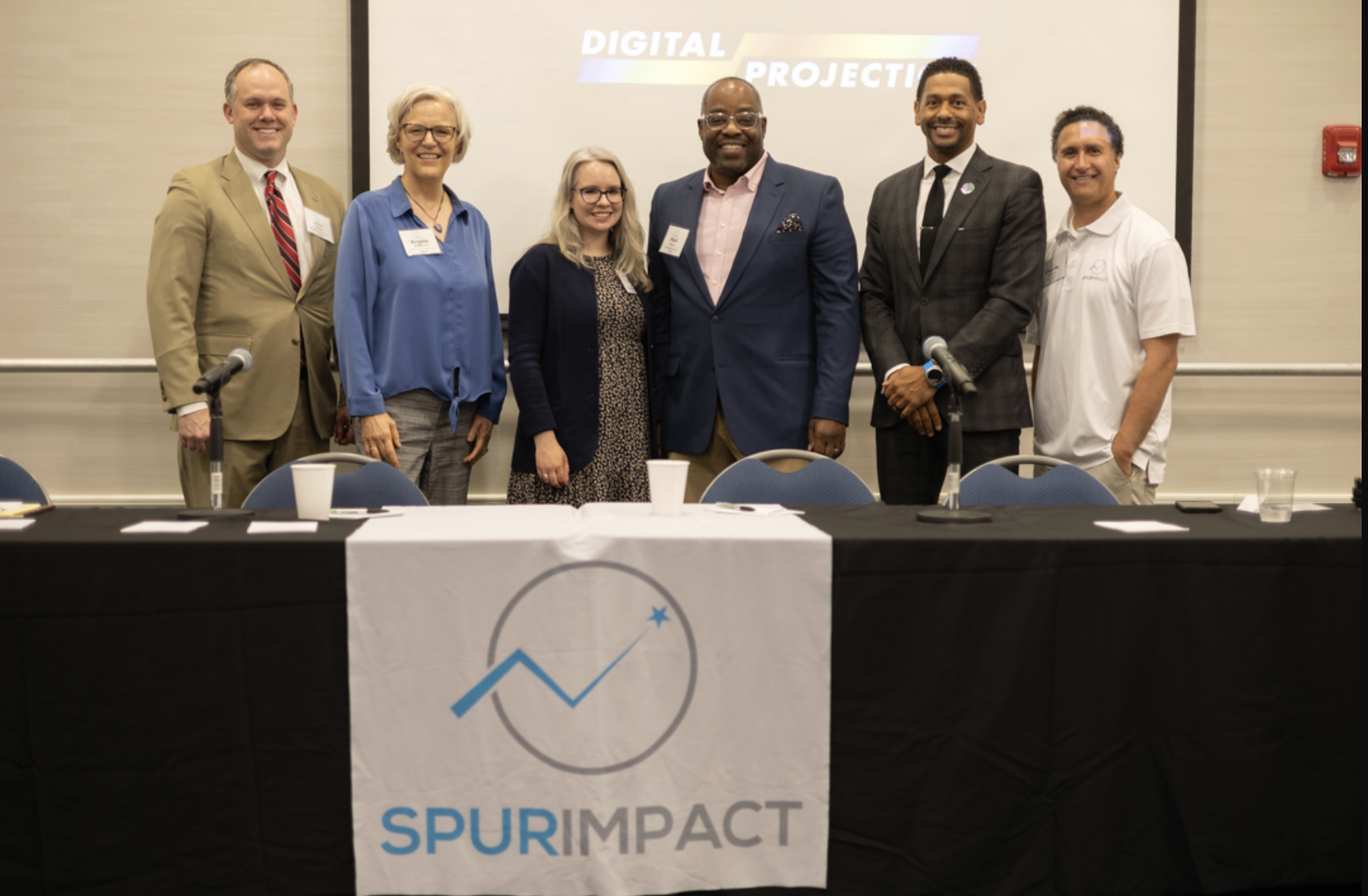 a group standing at a conference