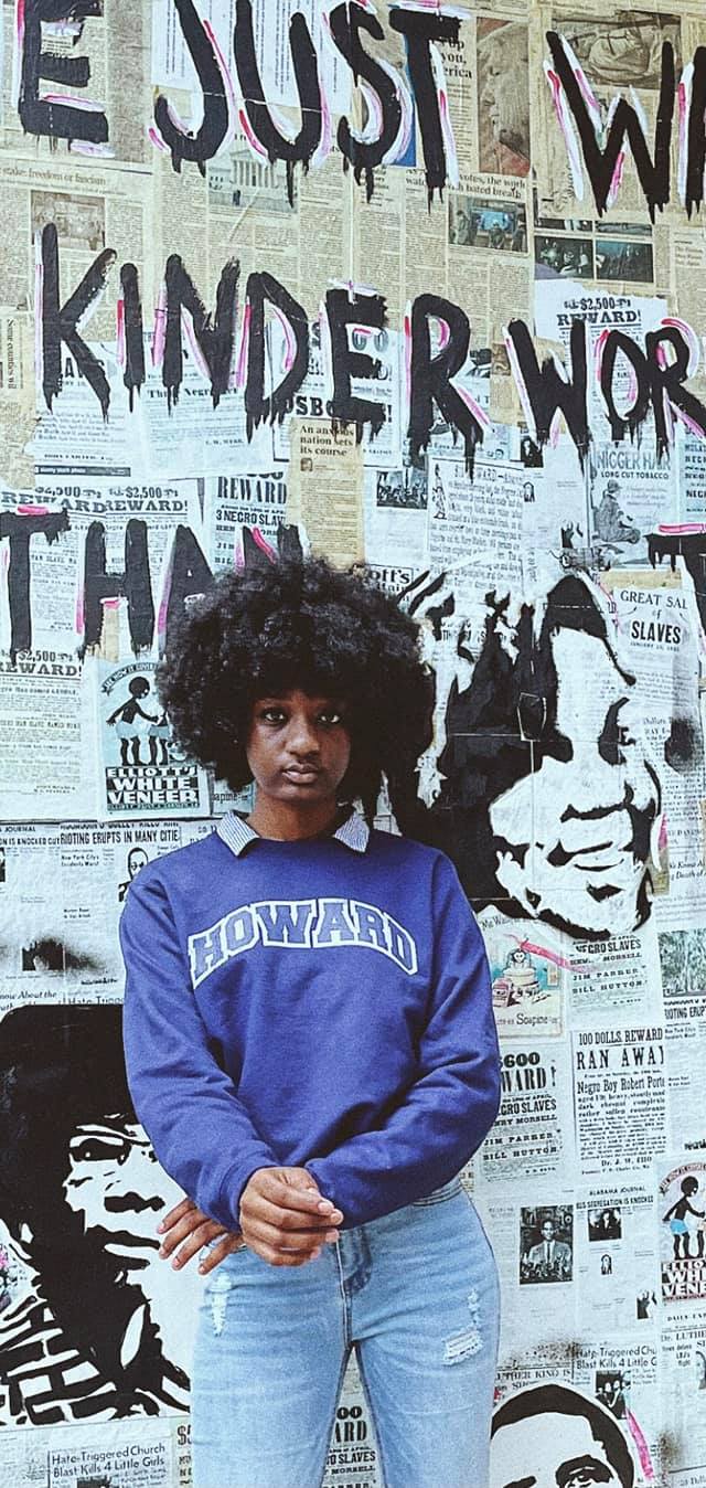 a person posing wearing a Howard University sweatshirt
