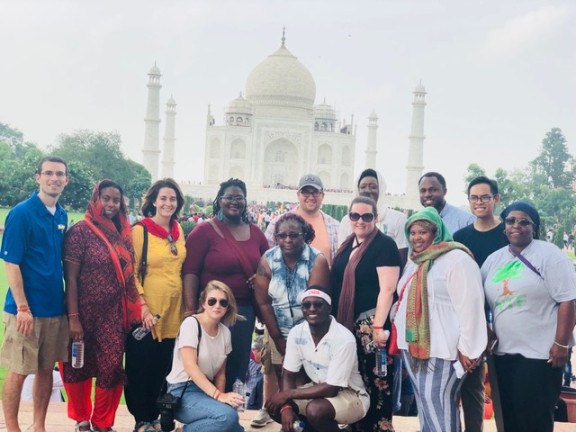 a group standing outside on a learning trip.