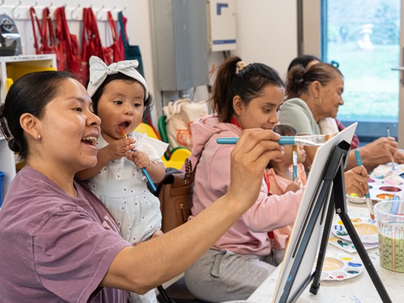 children painting with adults and intructors.