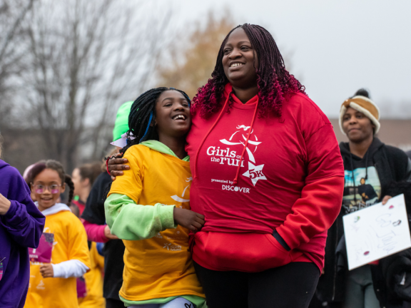 children and adults running in a race