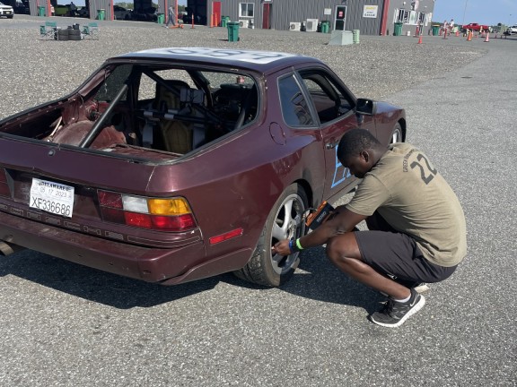 a person working on a car for vocational training