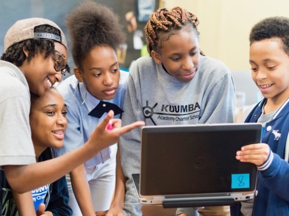 students working on a school computer.