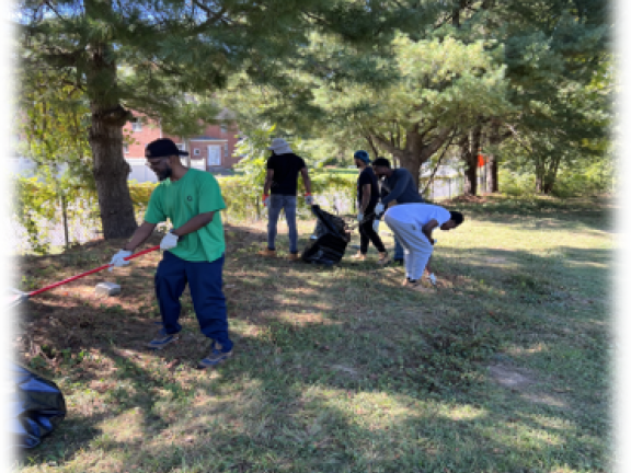 persons working outdoors landscaping and cleaning.