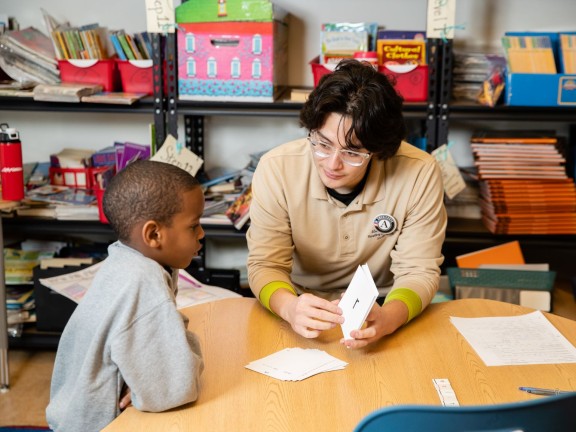 a Reading Assist tutor working with  a student.