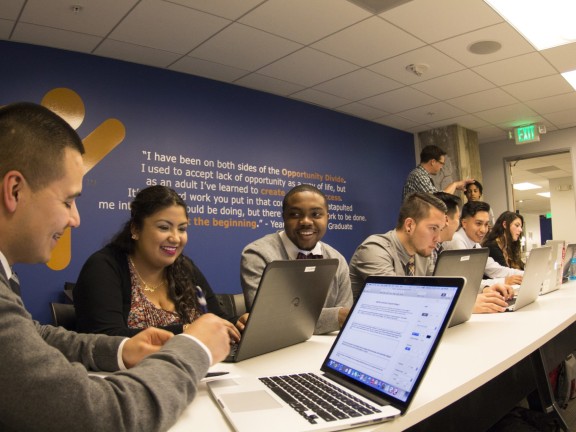 training participants on their computers in a workshop