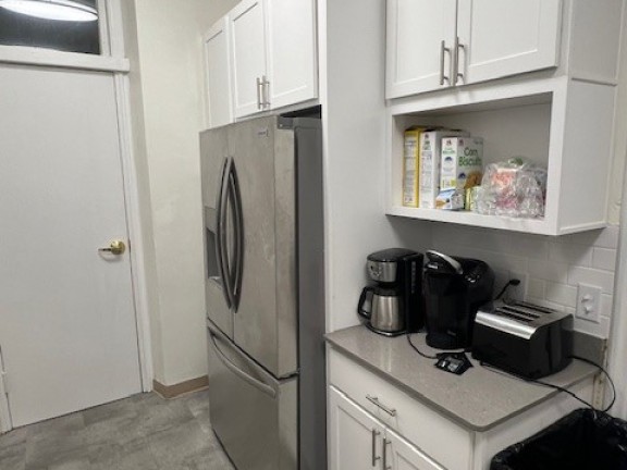 the inside of a newly renovated housing kitchen for sheltered women and families.