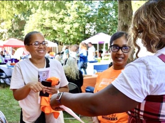 community health workers tabling in the community