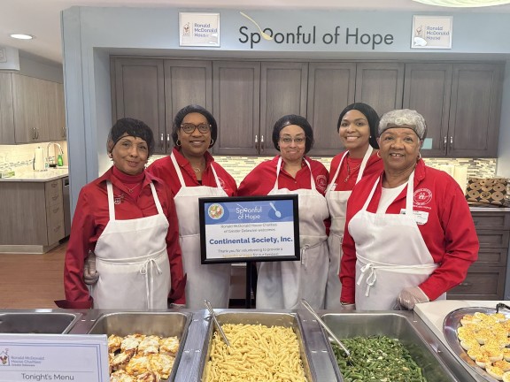 volunteers preparing food for a distribution program.