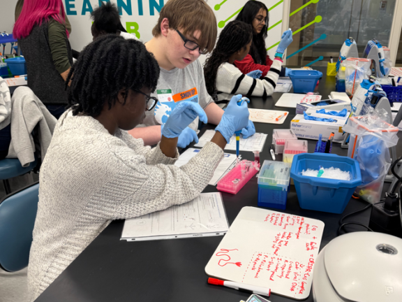 students experimenting in a classroom.