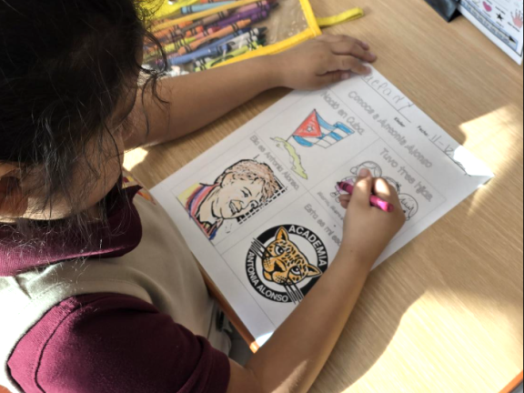 student drawing at a desk