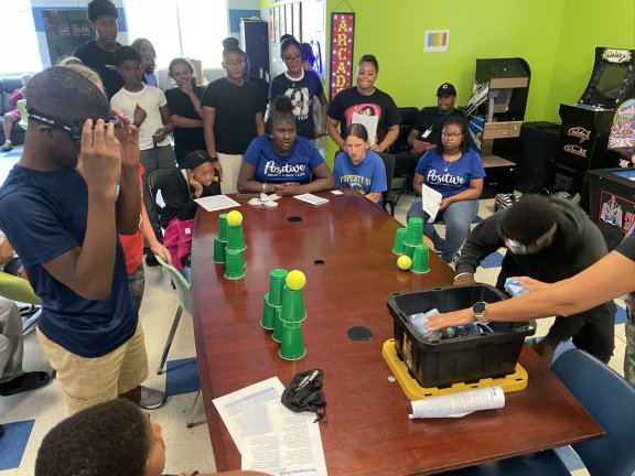 students experimenting at a table