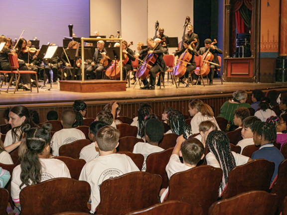 students watching a performance