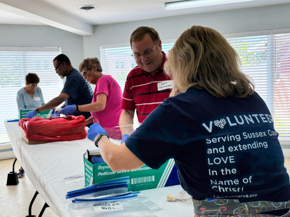 volunteers preparing items for a service project