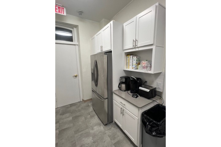 the inside of a newly renovated housing kitchen for sheltered women and families.