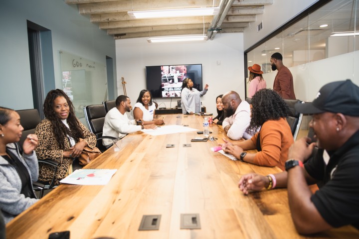 community leaders sitting at a table conducting workshops.