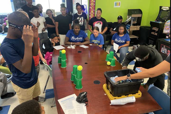 students experimenting at a table