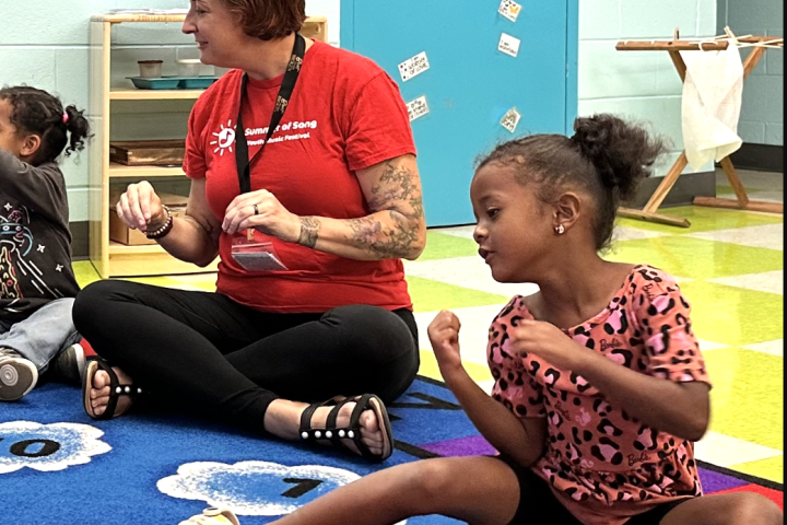 students singing with an instructor
