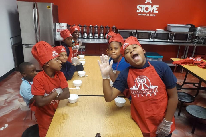 students posing in a cooking class