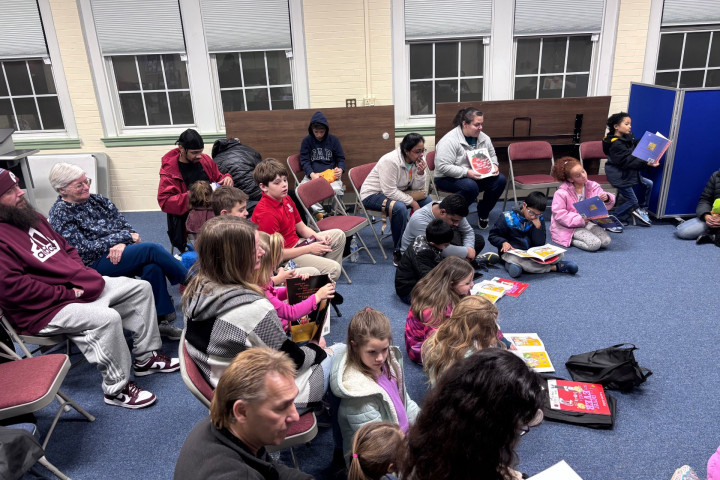 families sitting and reading books